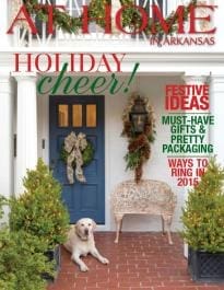 At Home Arkansas holiday cover featuring a wreath and dog.
