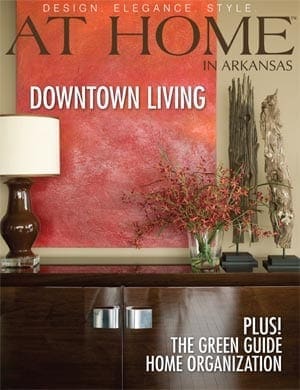 At Home in Arkansas magazine cover featuring red textured wall and floral arrangement.