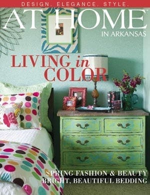At Home in Arkansas magazine cover featuring colorful bedding and furniture.