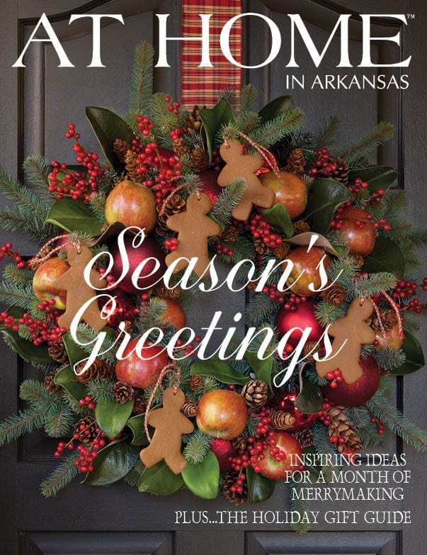 Holiday wreath with berries, pinecones, and oranges on a magazine cover.