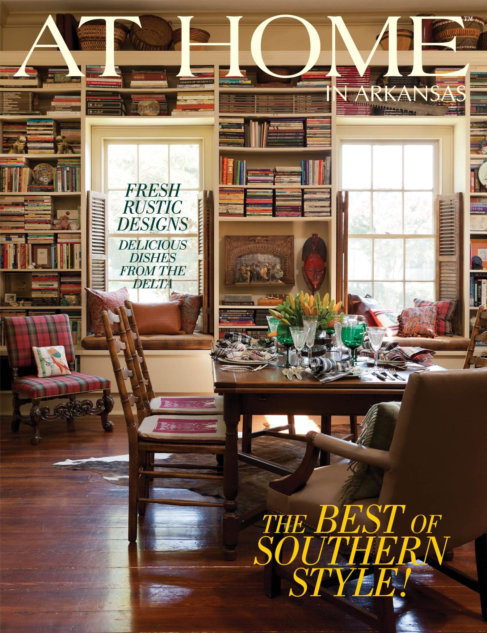 ‘At Home in Arkansas’ magazine cover featuring a bookshelf and dining area.