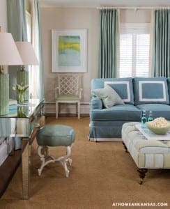 Light-blue sofa, armchair, and carpet in a living room.