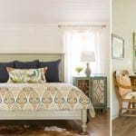 White bedroom with paneled walls, blue bedding, and patterned nightstands.