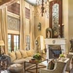 Large living room with a beamed ceiling and chandelier.