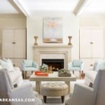 Cream-colored living room with fireplace and furniture.