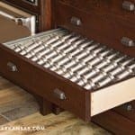 Dark wood kitchen drawer with silverware organizer