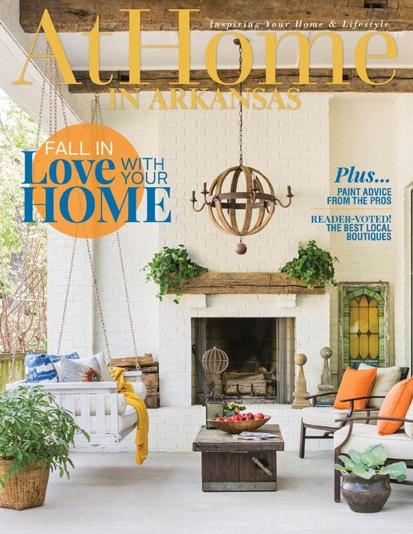At Home magazine cover featuring a stone fireplace and outdoor seating.