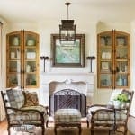 Formal living room with arched cabinets, fireplace, and seating.