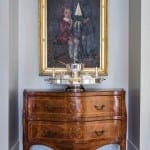 Gold framed portrait of two children with a silver tray.