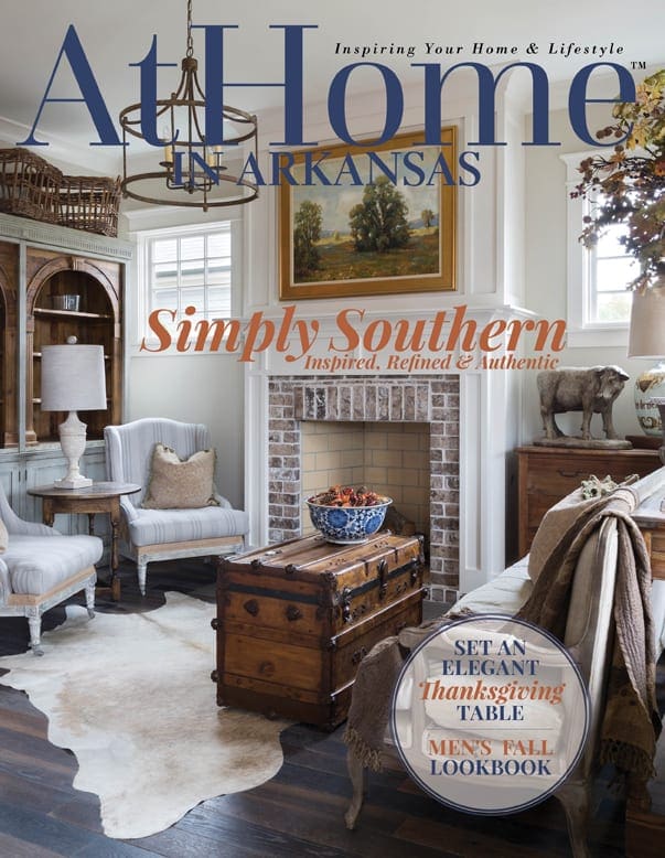 At Home in Arkansas magazine cover featuring a living room interior.