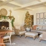 Living room with fireplace, sofa, and framed artwork.