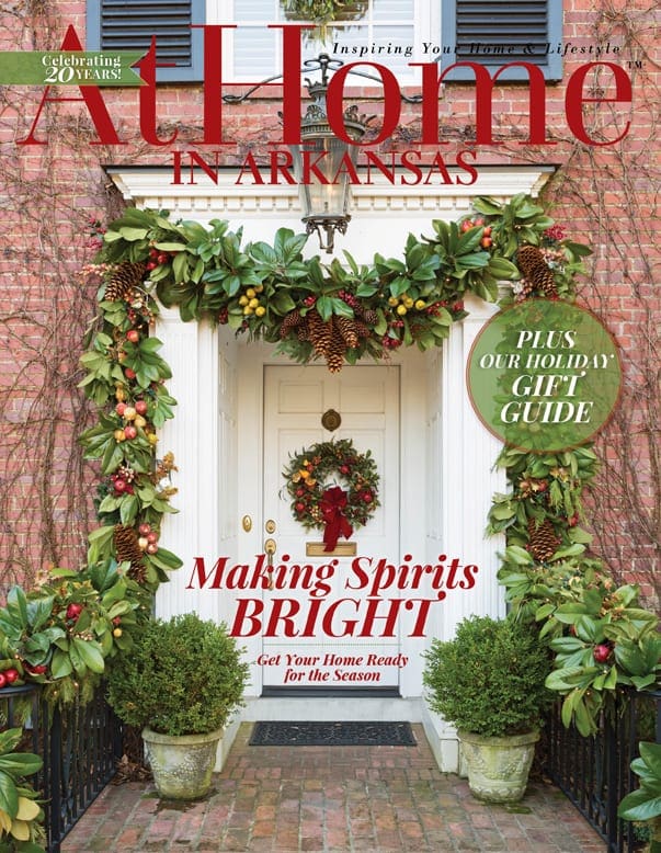 At Home magazine cover featuring a decorated porch with greenery and wreaths.