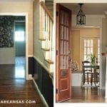 Hallway with dark wainscoting and staircase with striped runner. Open door reveals dining area.