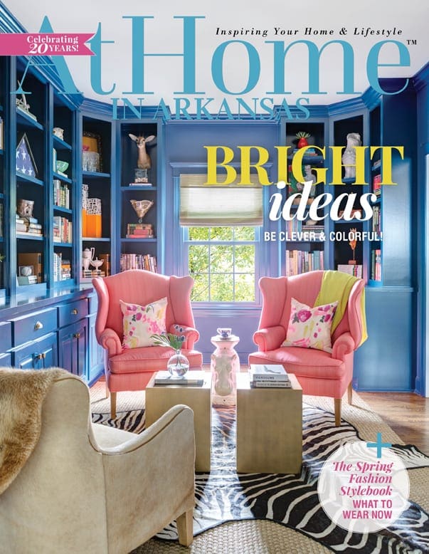 At Home in Arkansas magazine cover with pink chairs and blue built-in bookshelves