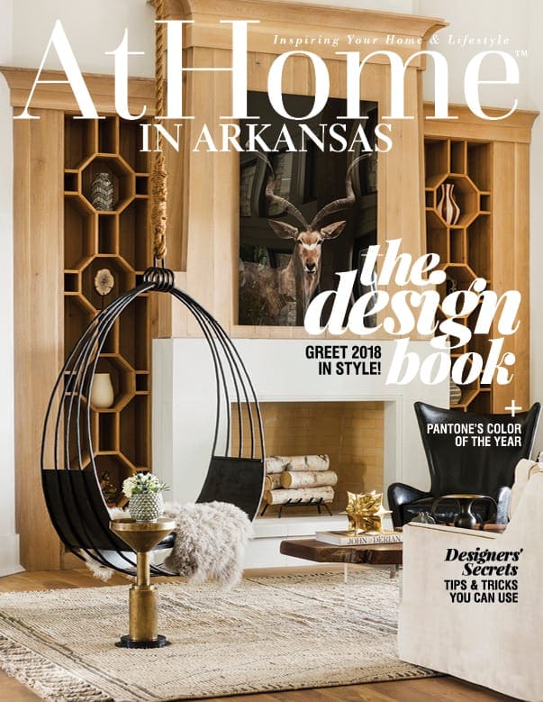 At Home in Arkansas magazine cover with living room, hanging chair, and fireplace.