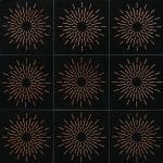 Nine black tiles with a copper sunburst pattern