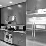Gray kitchen with stainless steel appliances, gas range, and double-door refrigerator.