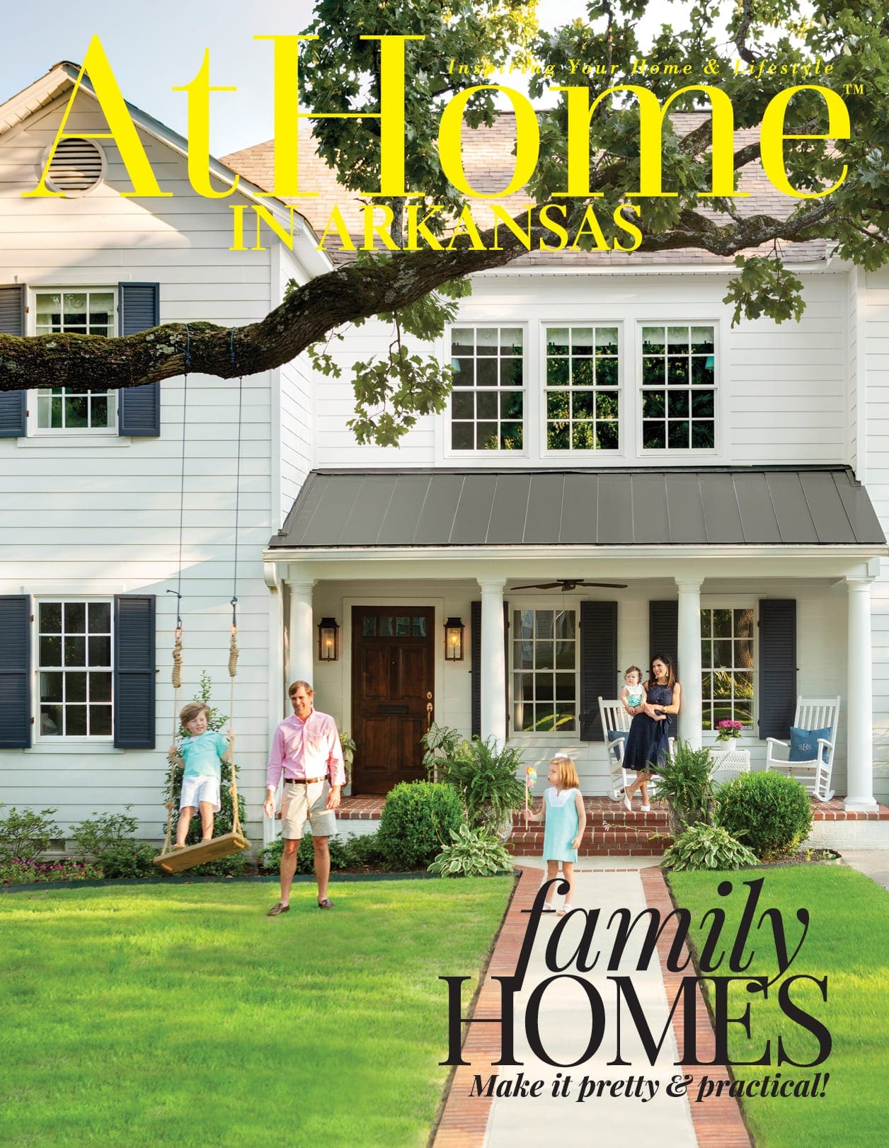 Arkansas Home magazine cover featuring a white house with a porch and family.