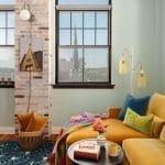 Brick fireplace wall with a window overlooking a city skyline.