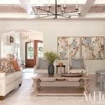 Large living room with wood ceiling and artwork.
