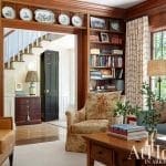 Wooden library with built-in shelves and seating.