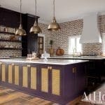 Dark purple kitchen with brick backsplash and gold cabinetry.
