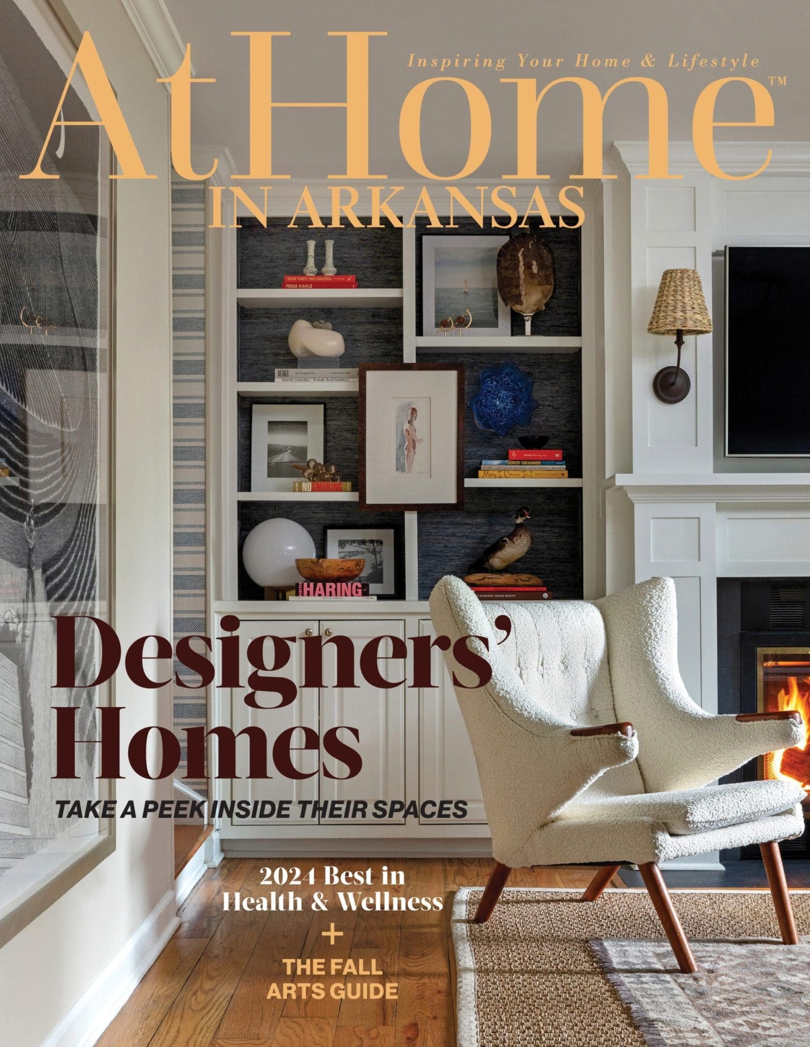 At Home in Arkansas magazine cover featuring a bookshelf and armchair.