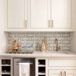 White cabinetry with a wine rack and bar area.