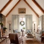 Arched ceiling with exposed wooden beams and window.