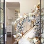 White staircase decorated with gold and white ornaments.