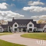 Two-story house with gray shingles and white facade, Arkansas