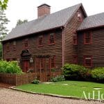 Red-shingled colonial house with a brick chimney, Arkansas.