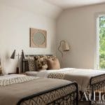 Bedroom with two beds, patterned pillows, and a window.