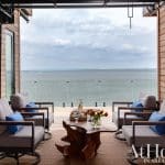 Wooden deck with seating area overlooking a lake in Arkansas.