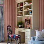 Red and white striped built-in bookcase with books and decorative items.