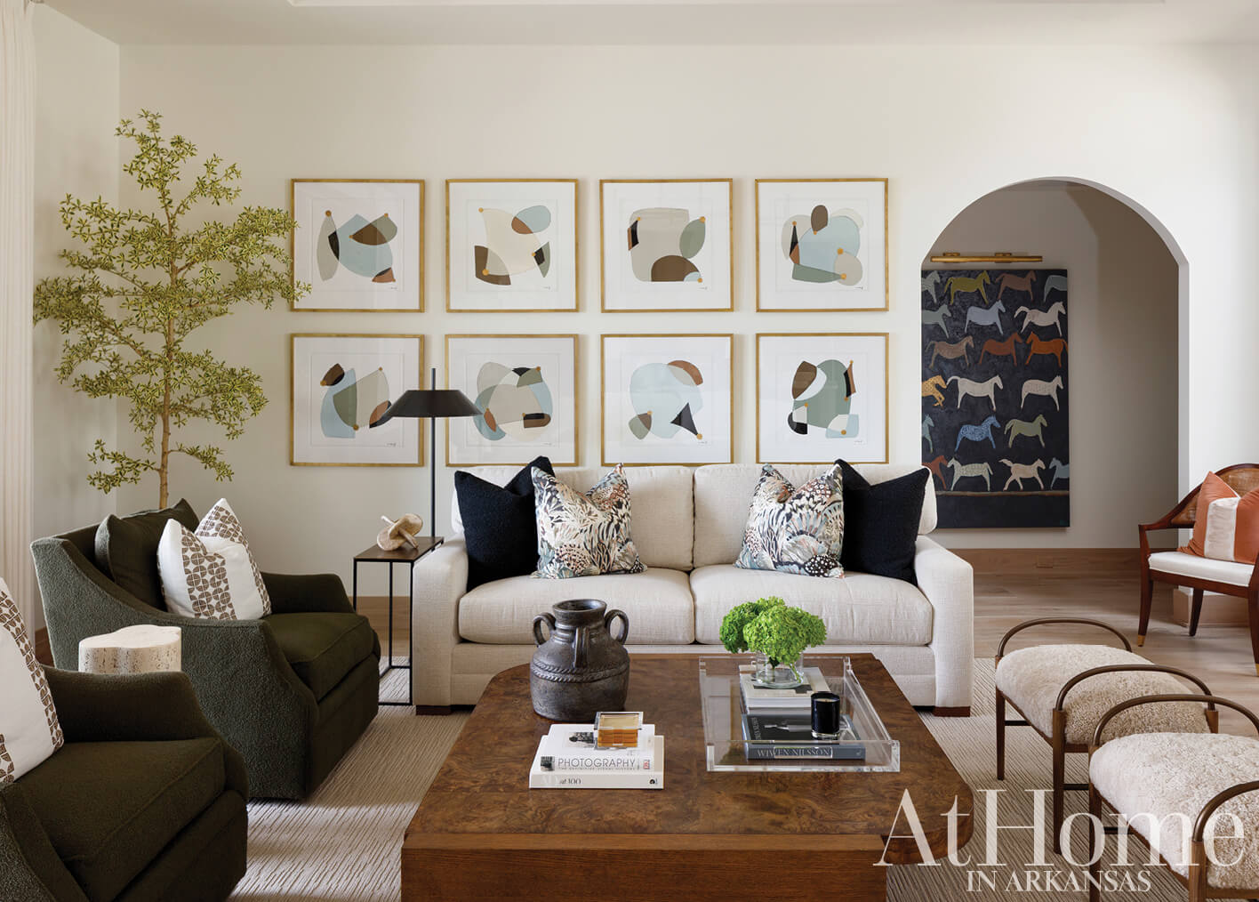 Living room with framed abstract art, sofa, and coffee table.