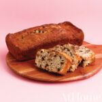Chocolate banana bread on a wooden cutting board.