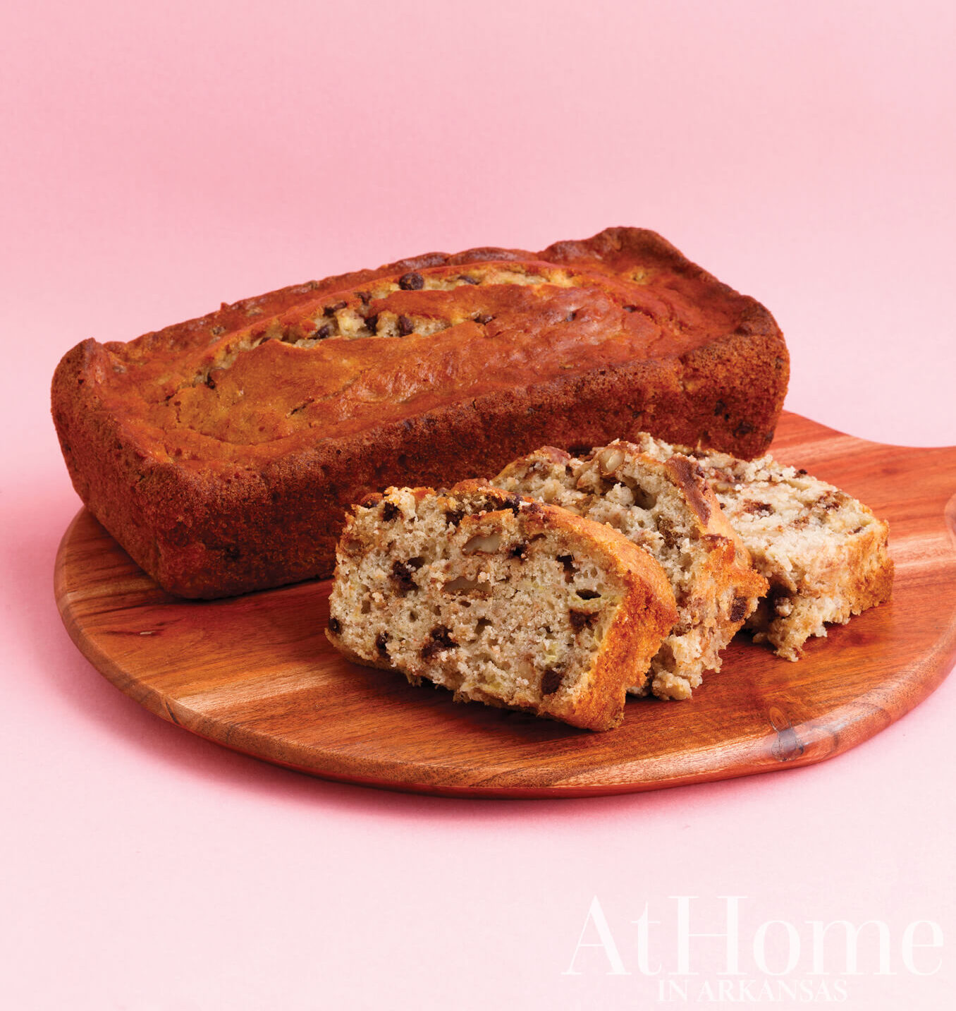 Chocolate banana bread on a wooden cutting board.