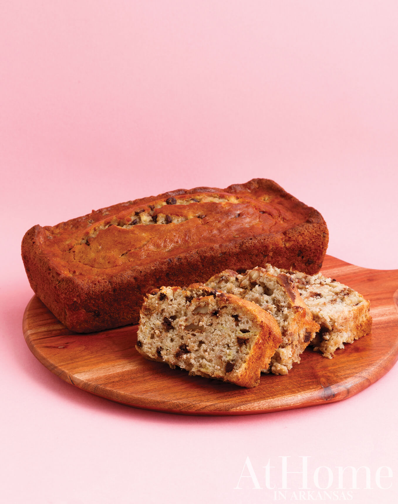 Chocolate banana bread on a wooden cutting board.