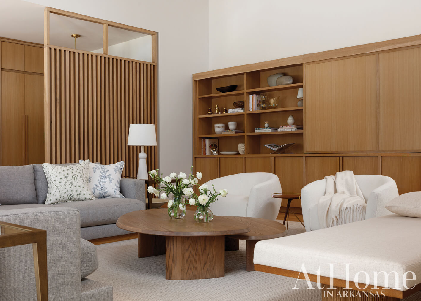 Wooden shelving unit with books and decorative objects.