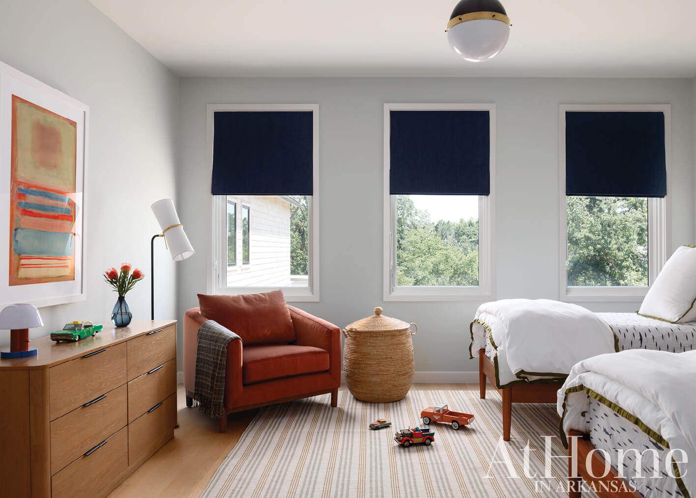 Arlington bedroom with two beds, window treatments, and furniture.