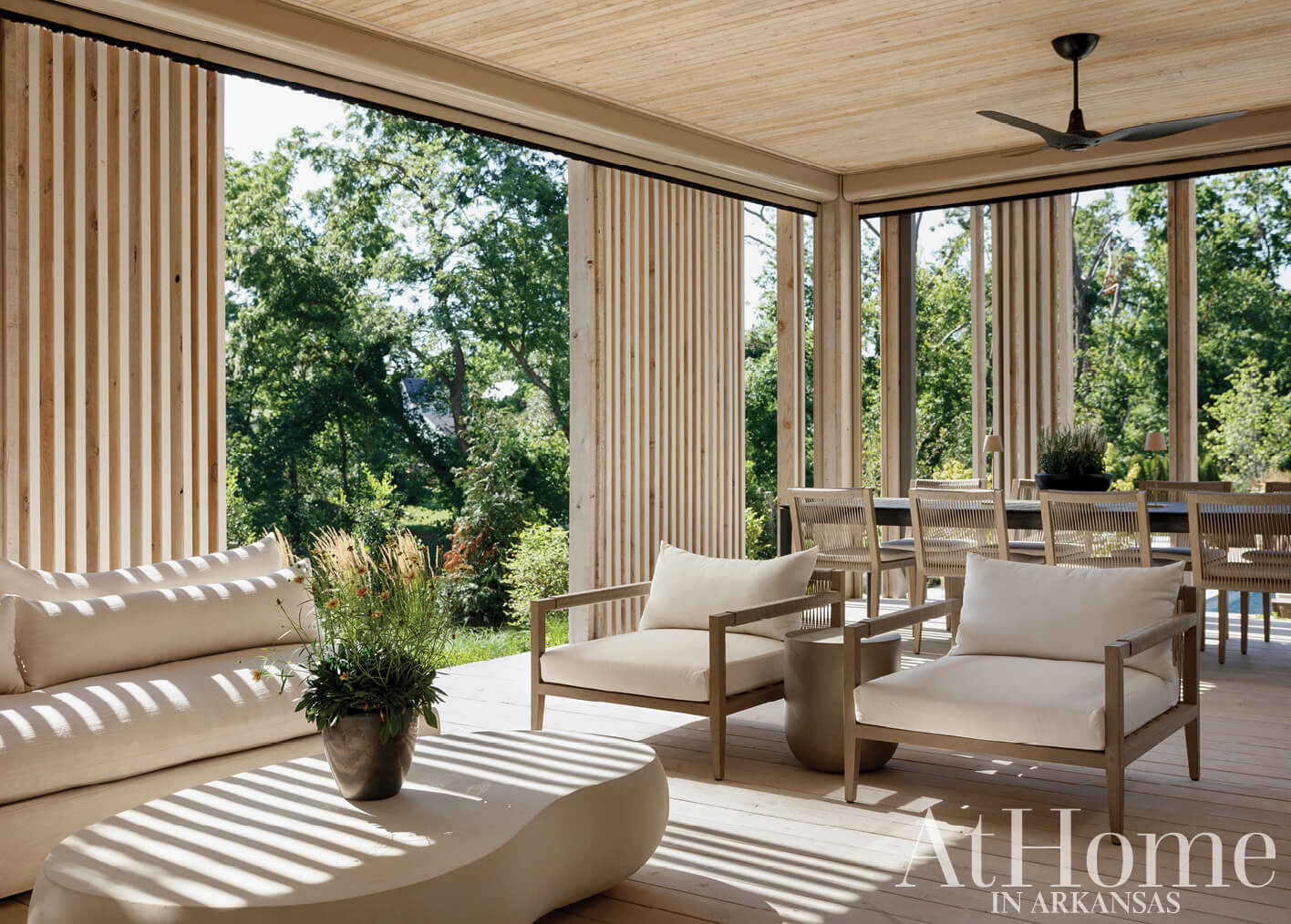 Wooden slat covered outdoor patio with seating.
