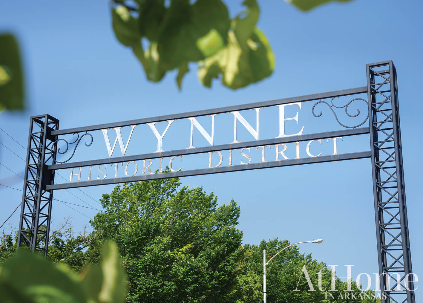 Metal sign reading ‘Wynne District Historic District’ in Arkansas.