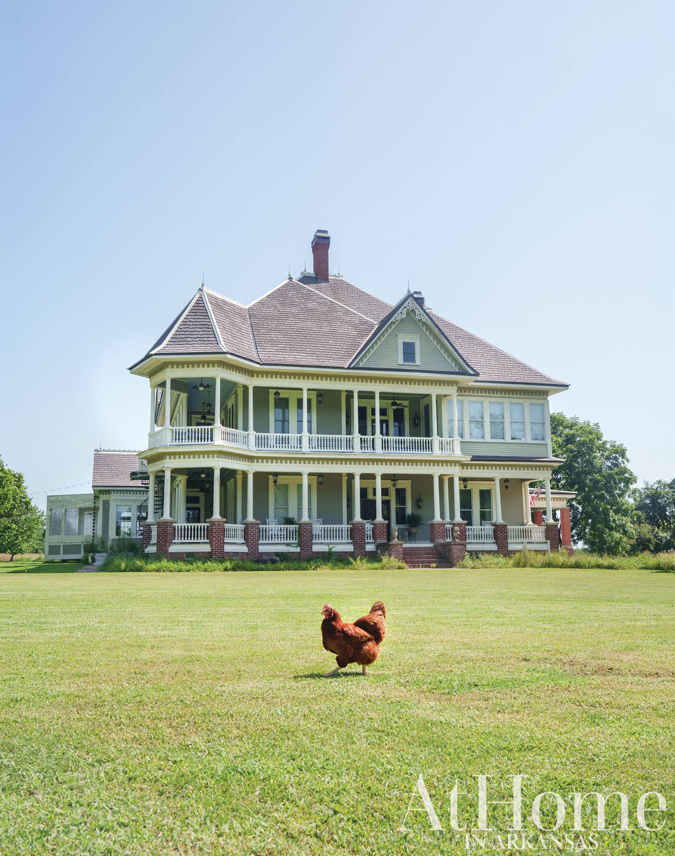Victorian house with a red roof and yellow trim, Arkansas.