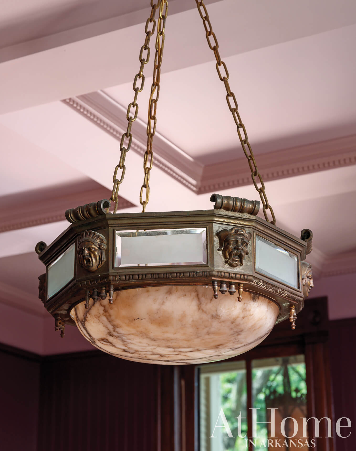 Ornate brass and glass chandelier with marble base.