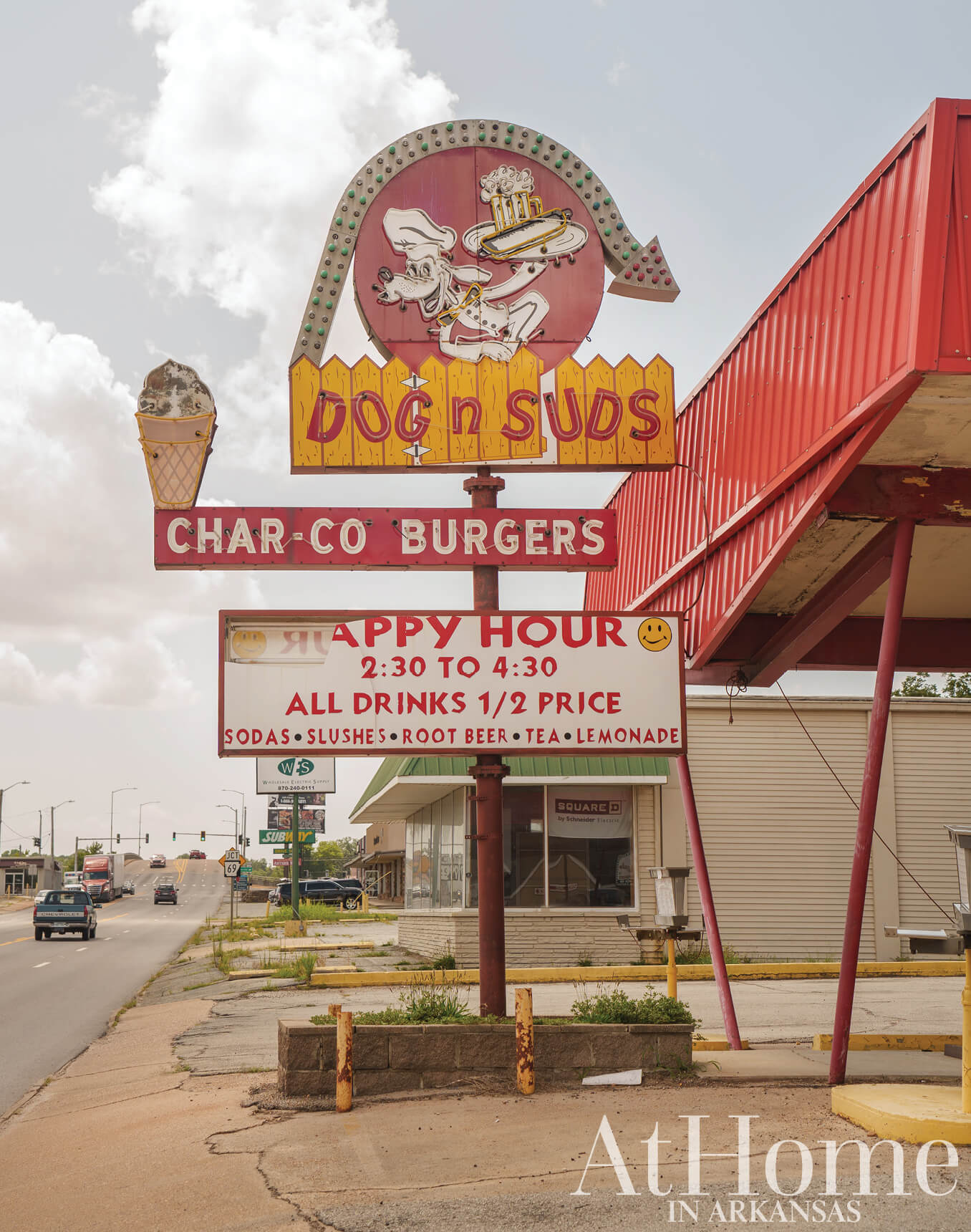 Dog n Suds sign with menu and promotional offers.