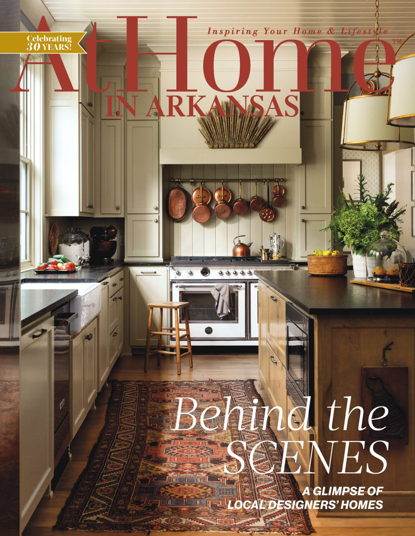 'At Home in Arkansas' magazine cover. Kitchen interior with copper pots and 'Behind the Scenes'